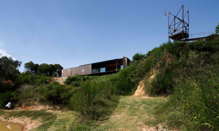 Views over a former goldmine-turned-sawmill โ the siteโs history remains evident in its striking topography. Photo by Ben Hosking.