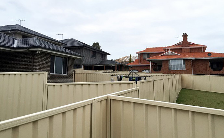 Fenced-in: a photo taken in Casula, Sydney. Otherothers seek a more open vision of suburbia. Photo by Damien Power.