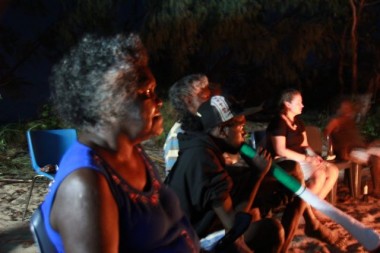 Singing and dancing by the campfire