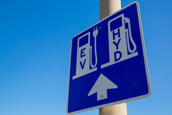 A sign for EV and HYD cars to charge and fuel.