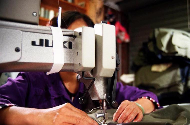 woman sewing machine supply chain human rights