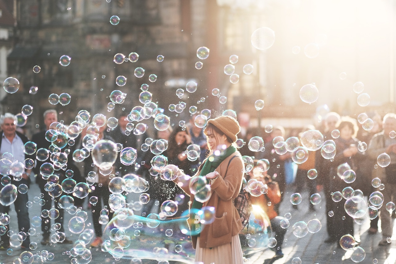 woman blowing bubbles