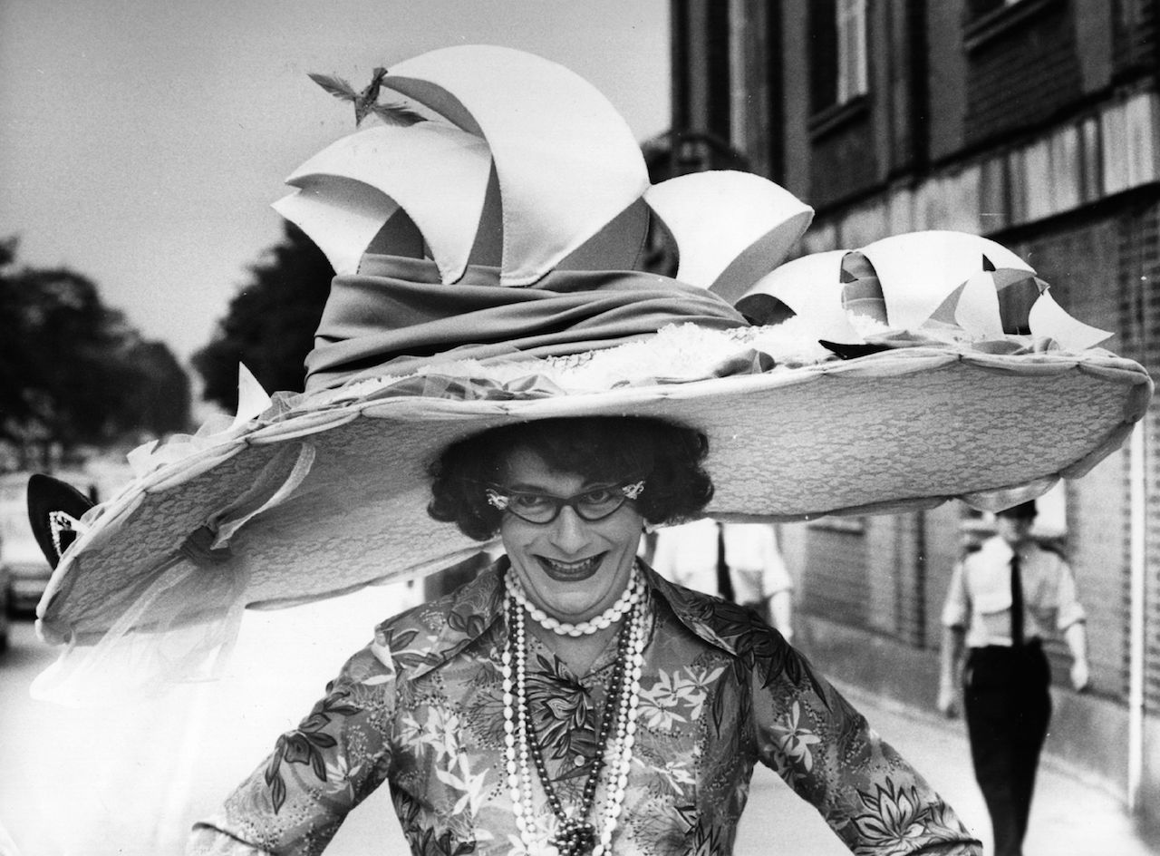 Dame Edna Everage ‚Äî a character created by Australian comedian Barry Humphries ‚Äî models a hat based on the Sydney Opera House. She is currently performing¬†Dame Edna's Glorious Goodbye: The Farewell Tour.