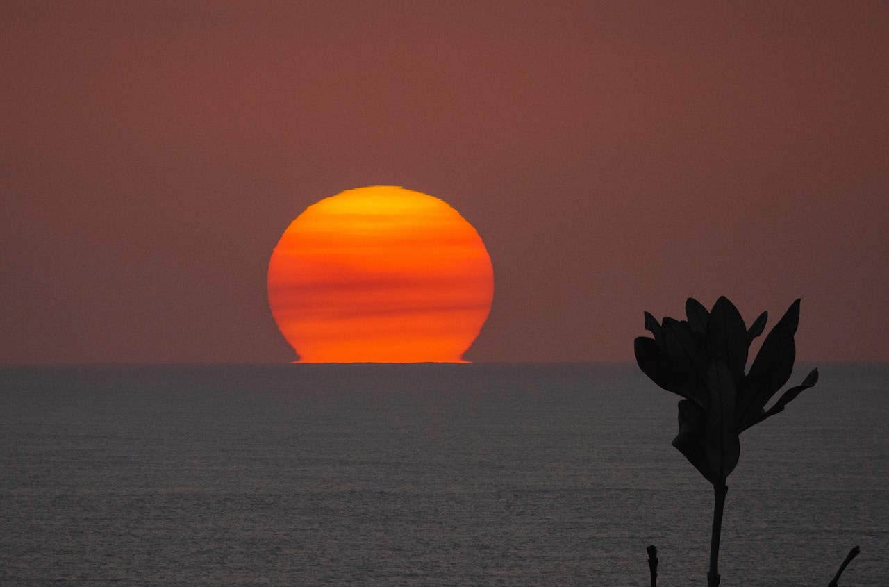 sunset over water australia smoke