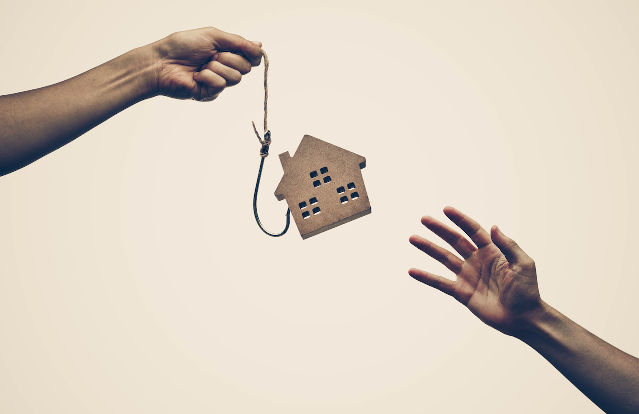 A house on a fish hook / Risks and negative sides of buying a house concept