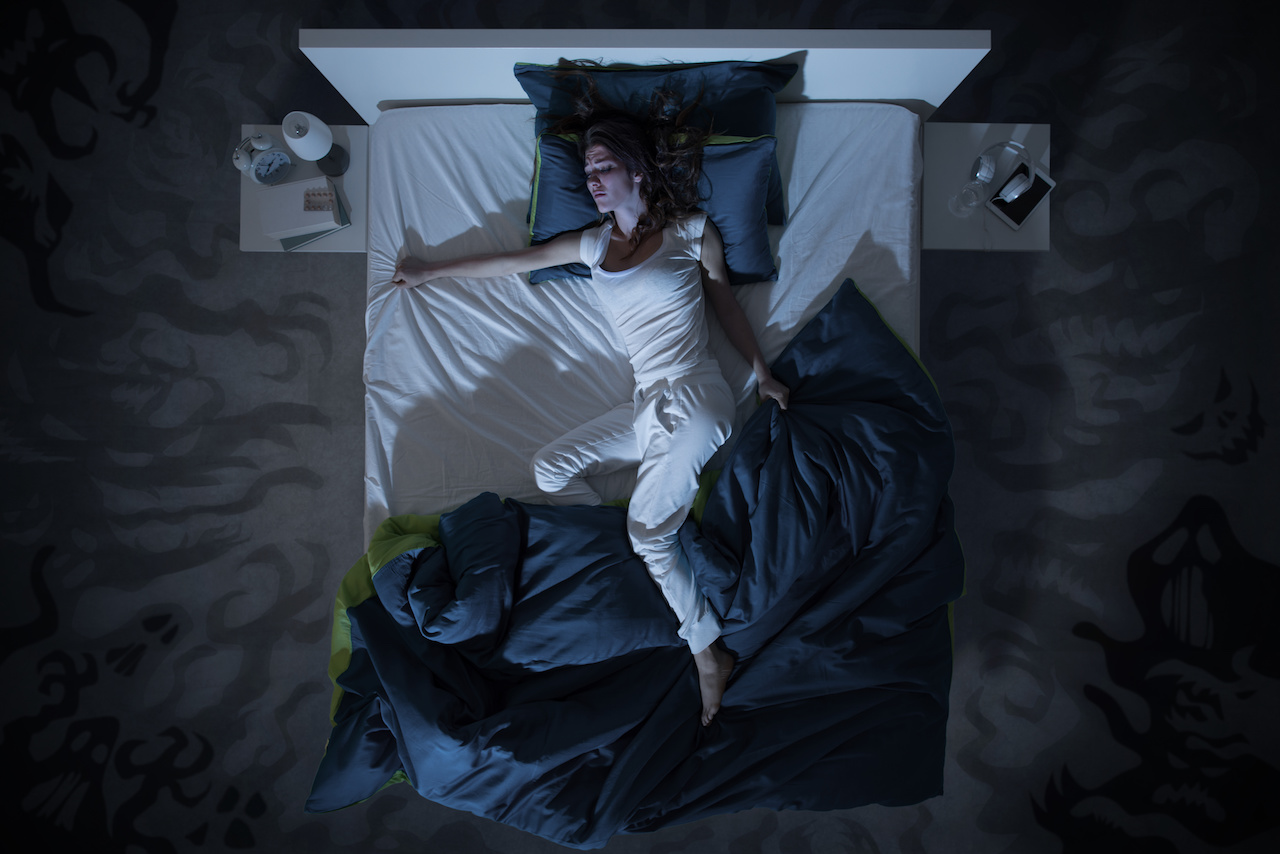 woman sleeping on bed