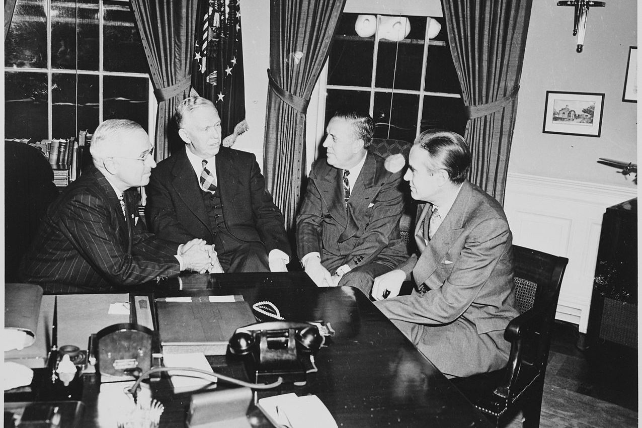men sitting in whitehouse