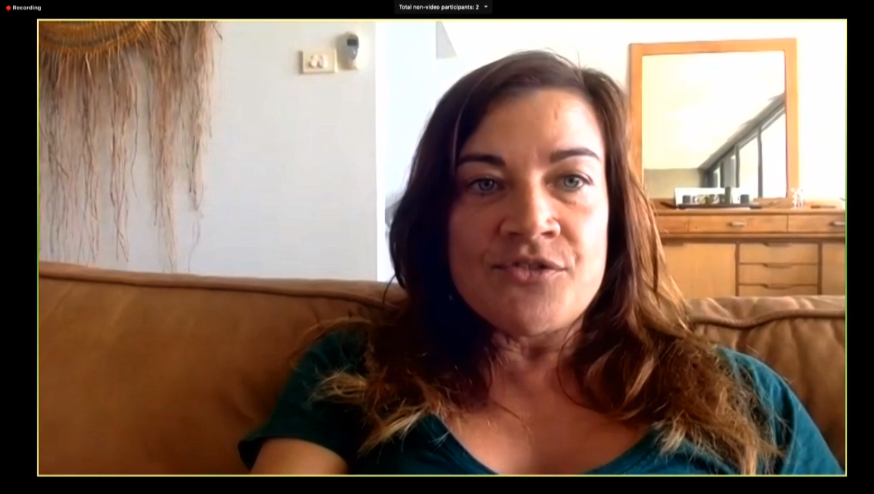 woman speaking into camera