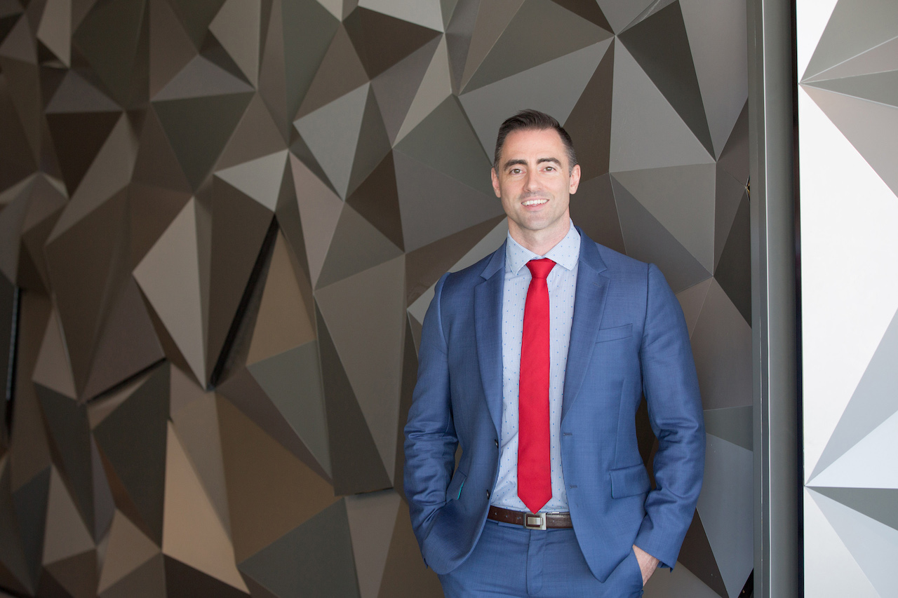 man standing by wall