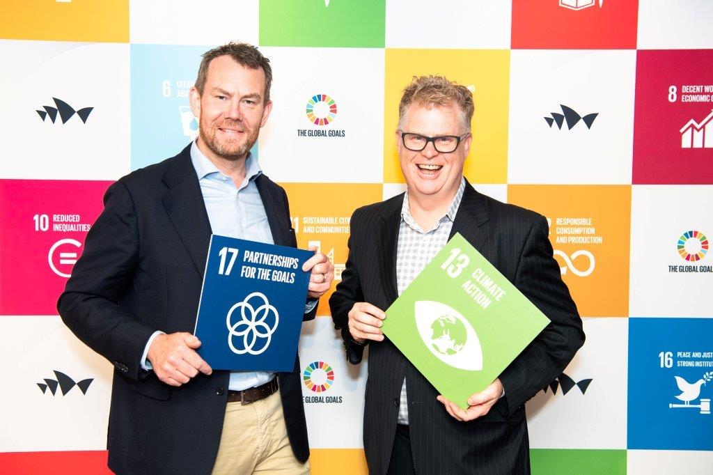 two men smiling at event