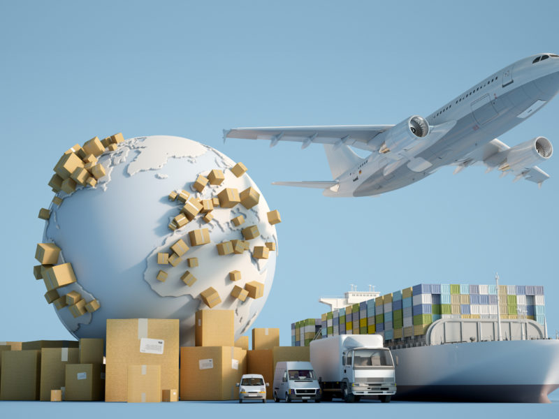 3D rendering of the Earth surrounded by cardboard boxes, a cargo container ship, a flying plane, a car, a van and a truck