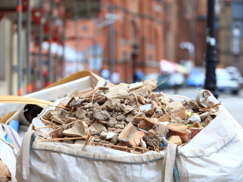 Full construction waste debris bags, garbage bricks and material from demolished house