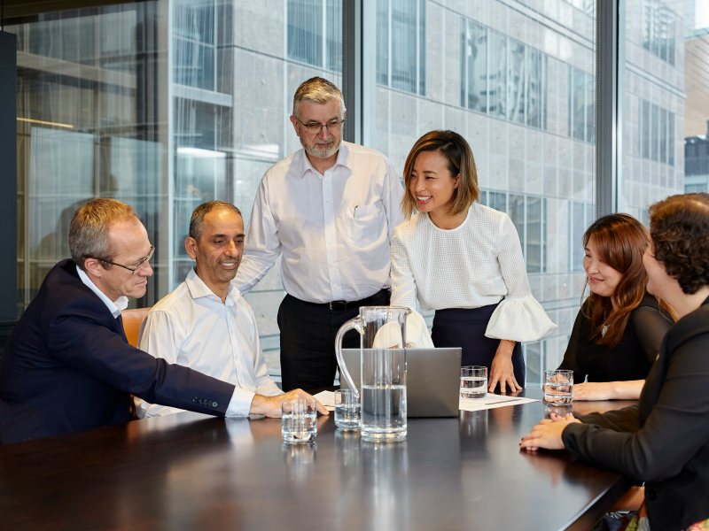 employees around a meeting table