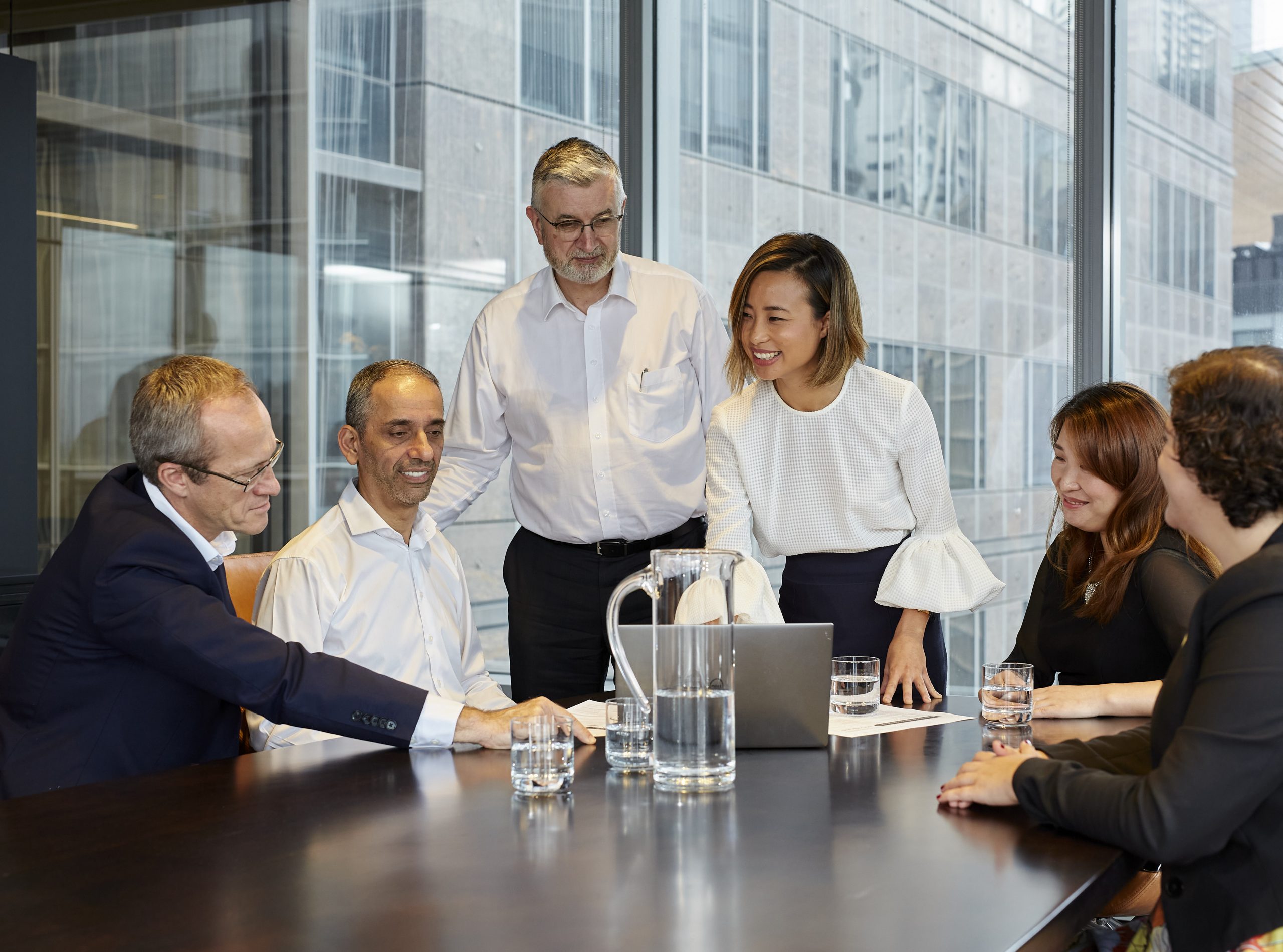 employees around a meeting table