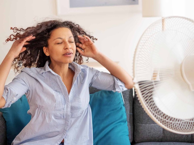 woman in front of fan hot