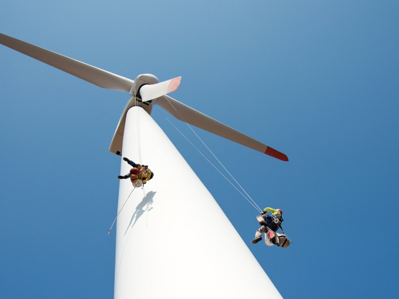 repair work on the blades of a windmill for electric power production - copy space
