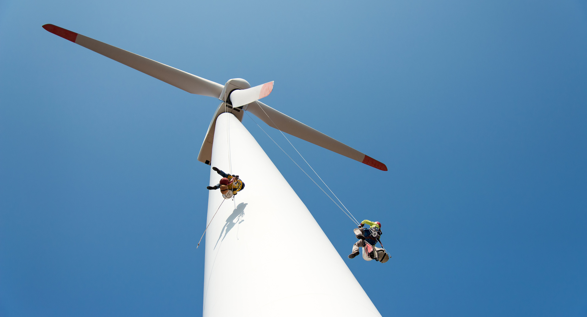 repair work on the blades of a windmill for electric power production - copy space