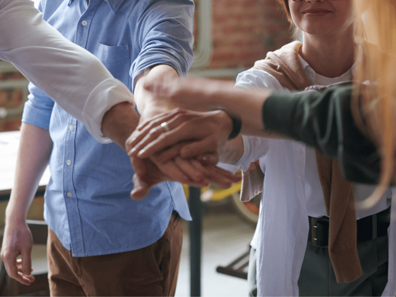 group of people holding hands