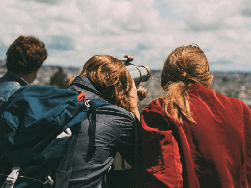 friends looking through binoculars