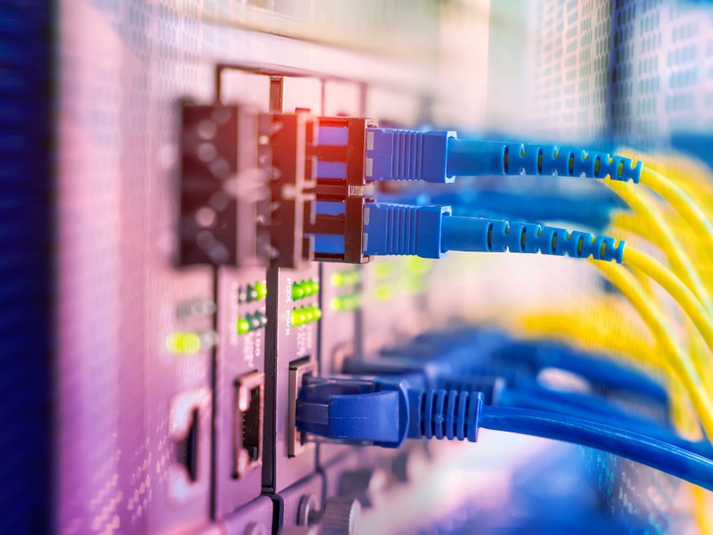 Fiber Optic cables connected to optic ports and UTP, Network cables connected to ethernet ports