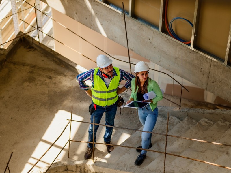 Architect and foreman meeting at construction site,Architect inspects the construction site, Construction project concept.